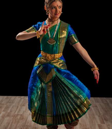 Young beautiful woman dancer exponent of Indian classical dance Bharatanatyam
