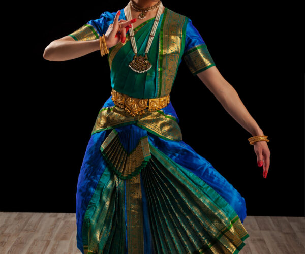 Young beautiful woman dancer exponent of Indian classical dance Bharatanatyam